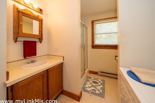 First floor full bathroom with laundry