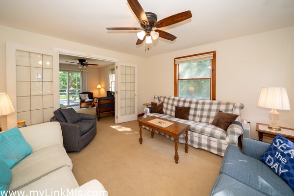 Den with french doors to the living room