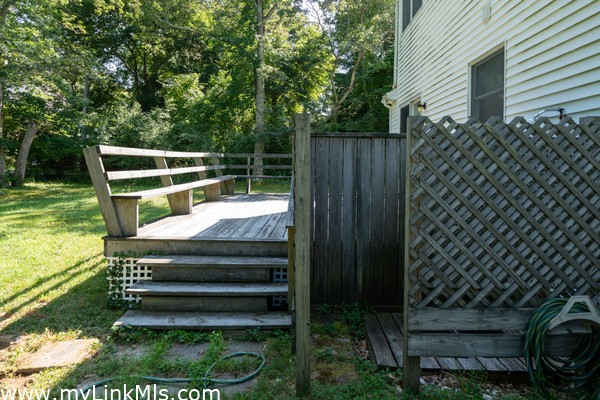 Outdoor shower and back deck off the living room.
