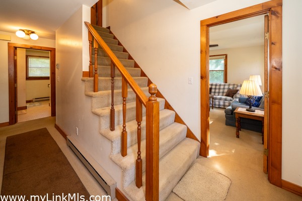 Hallway with closet space-looking toward the den