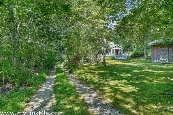 Driveway toward Main House,  after you pass the Guest Cottage on R.