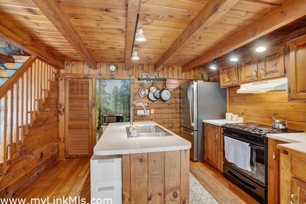 Kitchen w/ stairs to the Loft visible slightly on the left