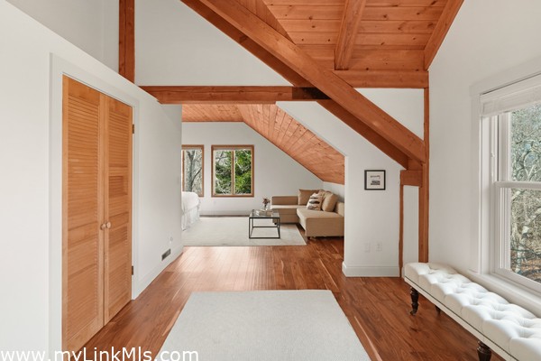 Open room leading to primary suite