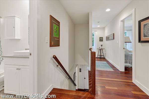 Hall with shared bath on left