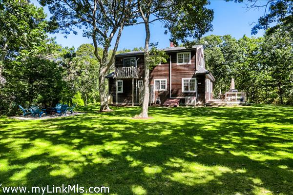 The back lawn abuts conservation land