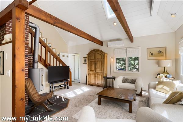 a double height living room with wood stove