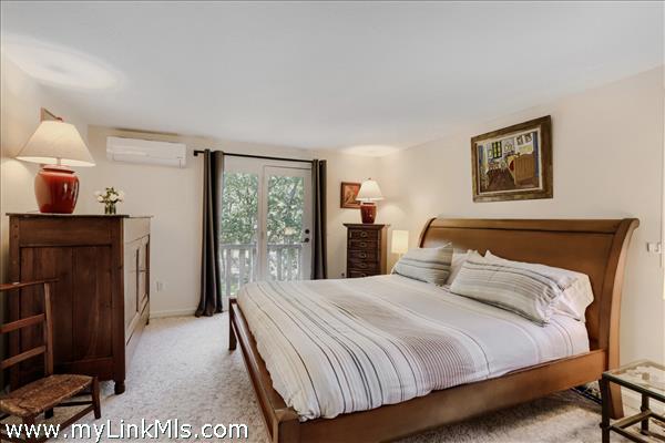 primary bedroom with balcony