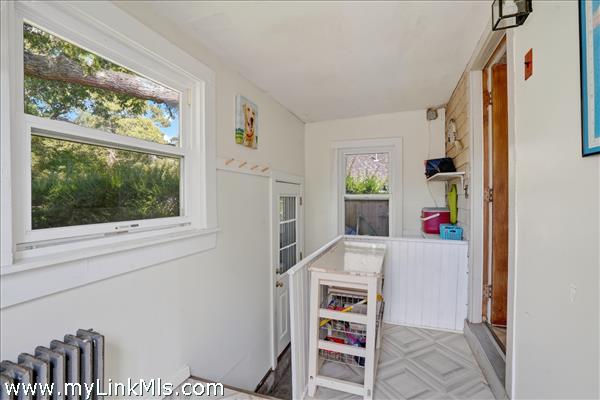 The rear entry also provides interior to the full basement.