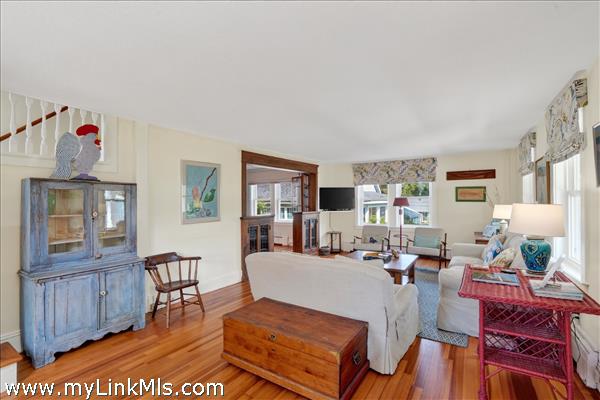 The spacious living room provides an inviting entrance from the covered front porch.